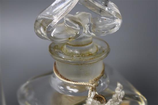 A Coty glass perfume bottle with frosted stopper, height 12cm, and a Guerlain Mitsouko perfume bottle, height 12cm